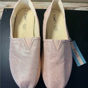 Brand new Toms Blush Metallic Slip-Ons